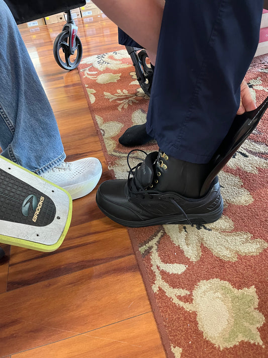Helping Someone With a Brace Get Their Shoes On